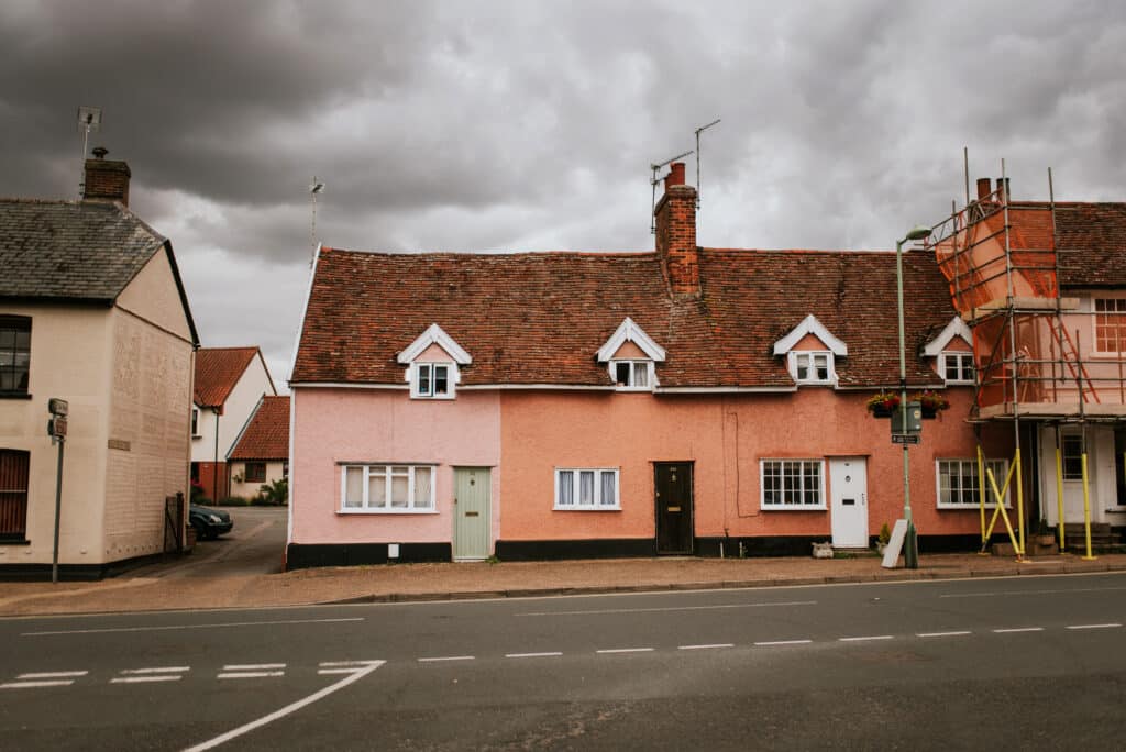 House on a street with grey clouds