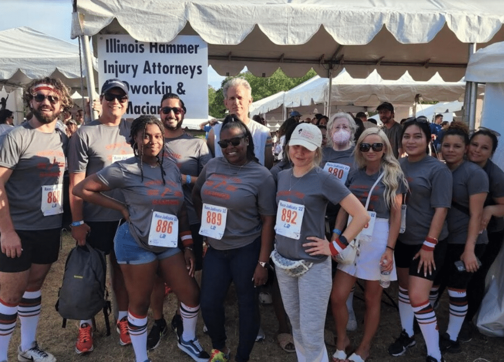 Illinois Hammer attorneys with custom shirts at Race Judicata in Lincoln Park, a benefit run for the Chicago Volunteer Legal Services posing for a picture