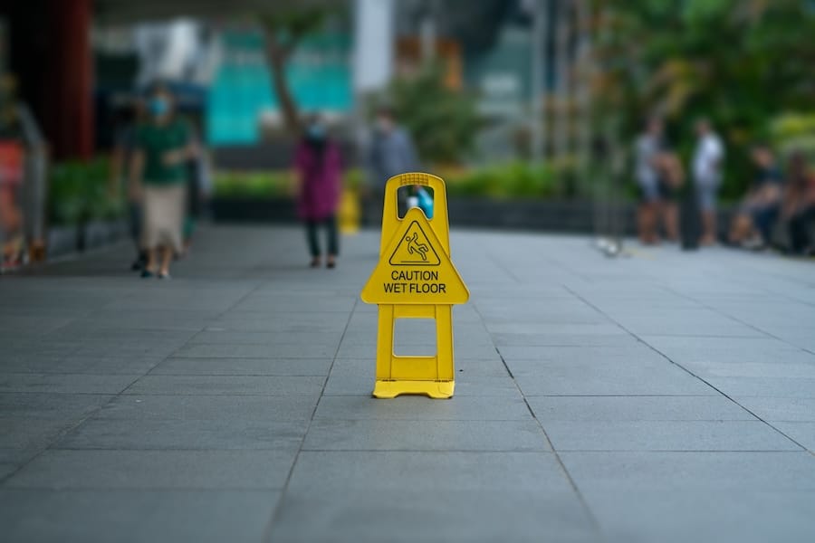 Caution wet floor sign or Orchard road, Singapore